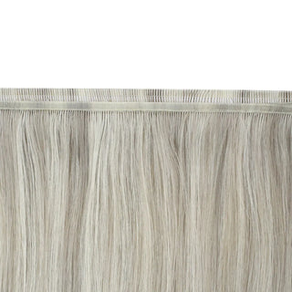 Virgin hair design mixing cool blonde and subtle lowlights for realism.