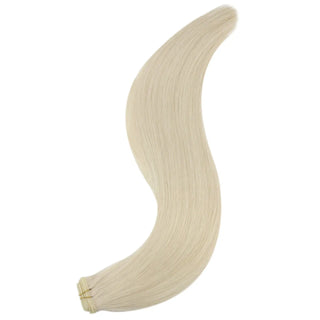 Bleach blonde invisible wefts providing seamless, natural coverage.