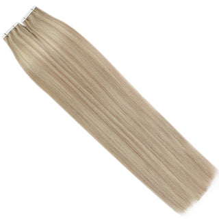 Blonde highlights tape in extensions from Full Shine feature virgin human hair with beautiful lowlight tones.