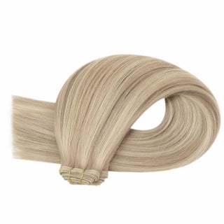 Virgin hair extensions mixing blonde lowlights with warm rose brown tones.