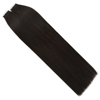 Dark brown virgin hair tape in extensions blend naturally with brunette hair while adding length and fullness.