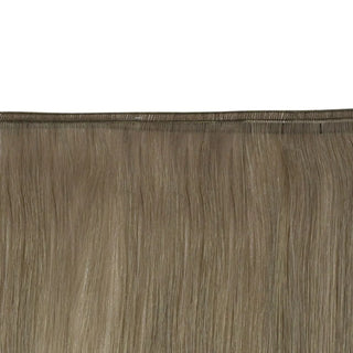Smooth ombre gradient providing a soft ash brown fade into luminous blonde.