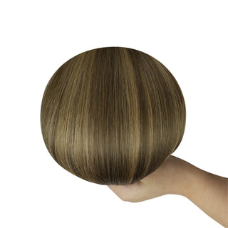Subtle brown balayage with blonde highlights in Fullshine’s lightweight invisible wefts.