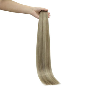 Invisible weft virgin hair offering a smooth ash-to-blonde multi-tone blend.