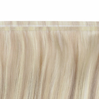Invisible weft virgin hair blending blonde softness with rose brown warmth.