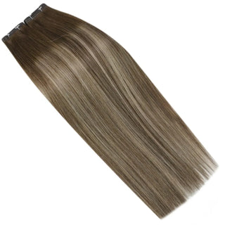 Fullshine lightweight invisible weft brown balayage with blonde highlight accents.