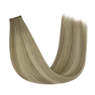 Natural ash brown virgin hair brightened with blonde streaks for depth and dimension.