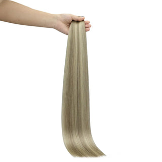 Ash brown balayage with blonde highlights for natural brightness and smooth blending.