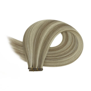 Light ash brown balayage and blonde accents offering a cool-toned multidimensional finish.