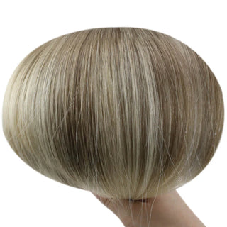 Brown base fading into blonde tones for a sun-kissed look.