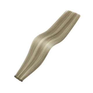 Fullshine natural virgin hair showing ash brown softness and blonde luminous highlights.