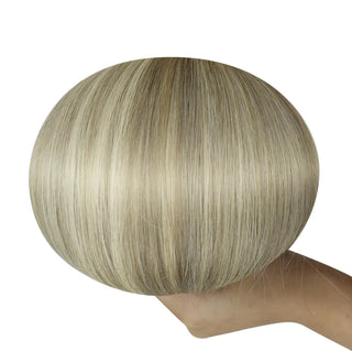 Soft ash brown balayage highlighted with luminous blonde for a natural sunlit look.