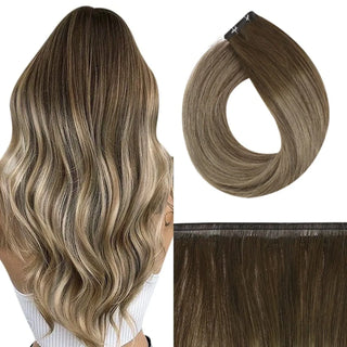 Fullshine brown balayage virgin hair with blonde highlights in invisible and flat silk weft for a dimensional look.