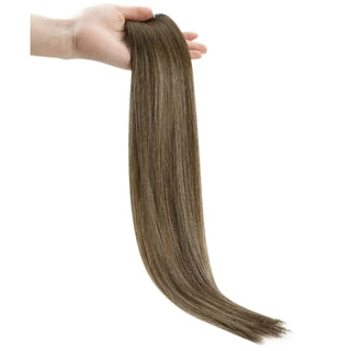 Fullshine subtle brown balayage with bright blonde highlights for a sun-kissed effect.
