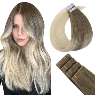Fullshine ombre brown to blonde virgin tape ins blending dark roots into bright ends.