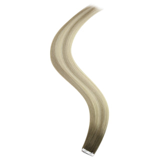 Full Shine cool brown to blonde injection tape hair extensions featuring a soft color transition and comfortable tape application.