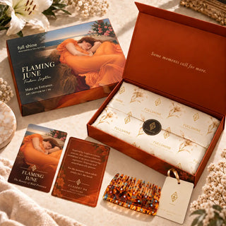 Full Shine Flaming June packaging collection featuring the orange art box, branded tissue paper, collector cards, and tortoiseshell hair comb.