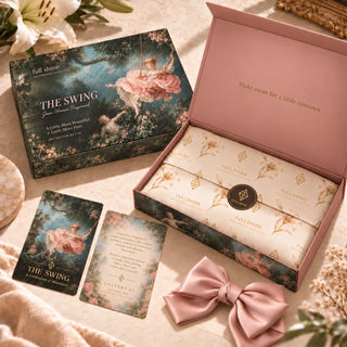 Full Shine The Swing packaging collection featuring the pink gift box, cream branded tissue paper, collector cards, and satin bow accessory.