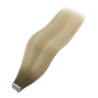 Full Shine brown to blonde ombre tape in hair extensions with injection technology, made from virgin hair for smooth movement.
