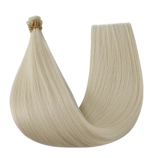 Full Shine platinum blonde genius weft virgin hair extensions with natural blending effect for a smooth salon look.